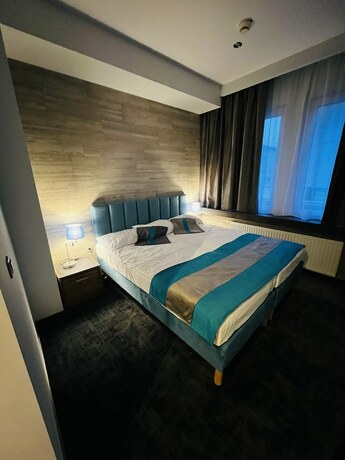Imagen de la habitación del Hotel Mhotel. Foto 19