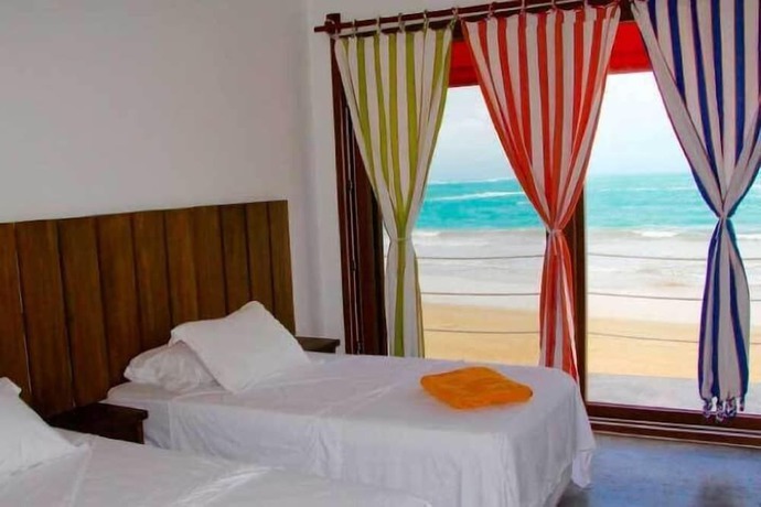 Imagen de la habitación del Hotel Mi Playa Beach front Isabella. Foto 6