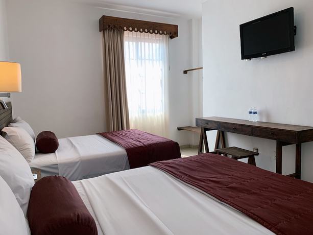 Imagen de la habitación del Hotel Mi Solar Ejecutivo. Foto 4