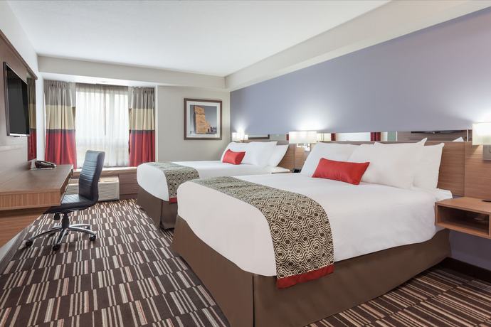 Imagen de la habitación del Hotel Microtel Inn and Suites By Wyndham Oyster Bay. Foto 11