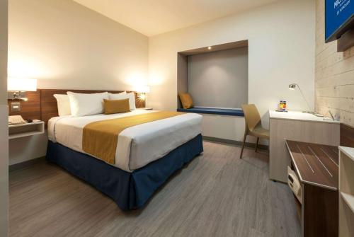 Imagen de la habitación del Hotel Microtel Inn and Suites by Wyndham Guadalajara Sur. Foto 12