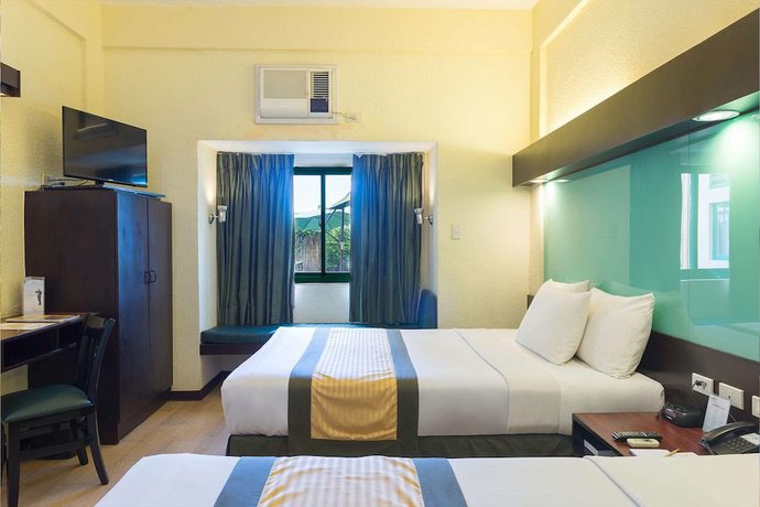 Imagen de la habitación del Hotel Microtel by Wyndham Cabanatuan. Foto 14