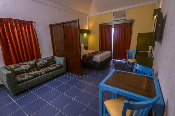 Imagen de la habitación del Hotel Microtel by Wyndham Puerto Princesa. Foto 5