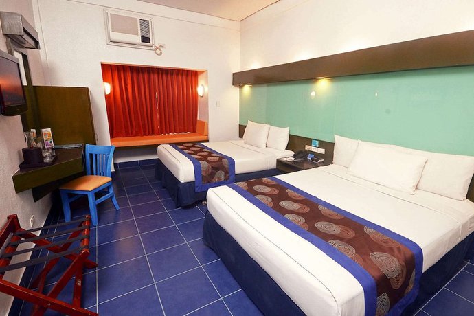 Imagen de la habitación del Hotel Microtel by Wyndham Puerto Princesa. Foto 6