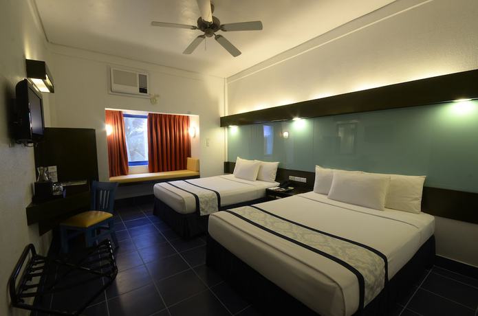 Imagen de la habitación del Hotel Microtel by Wyndham Puerto Princesa. Foto 10