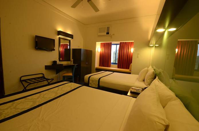 Imagen de la habitación del Hotel Microtel by Wyndham Puerto Princesa. Foto 12