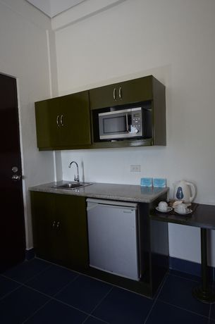 Imagen de la habitación del Hotel Microtel by Wyndham Puerto Princesa. Foto 15