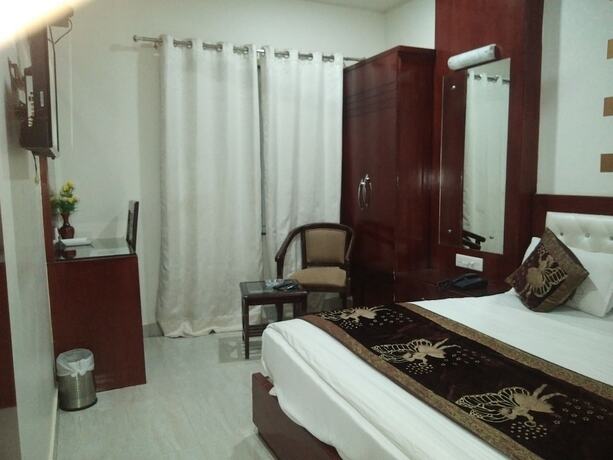Imagen de la habitación del Hotel Midcity. Foto 17