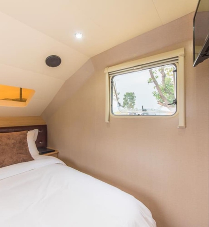 Imagen de la habitación del Hotel Midea Egret Lake Car Camp. Foto 8