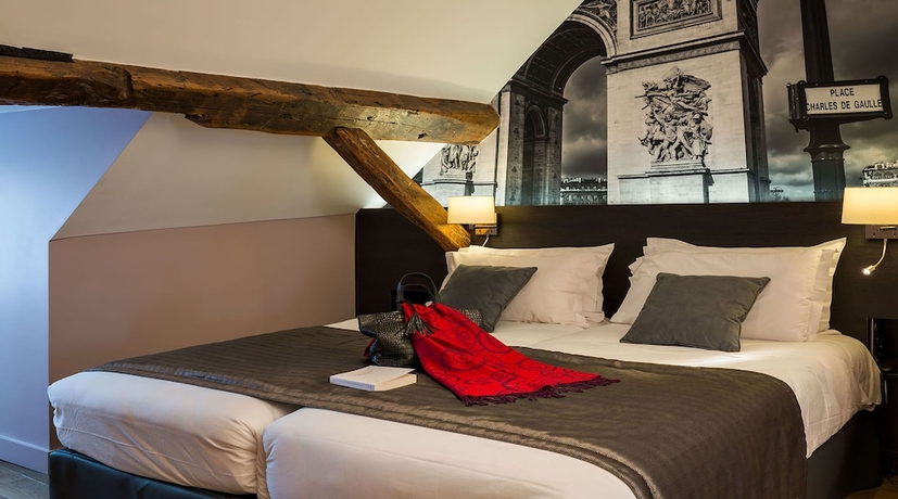 Imagen de la habitación del Hotel Midnight Paris. Foto 16