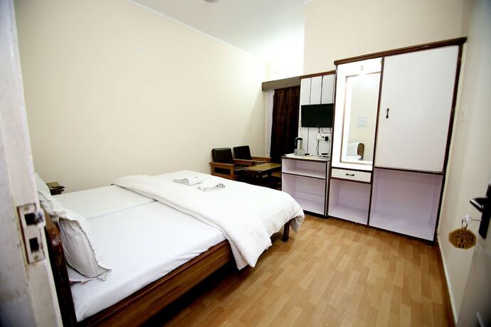 Imagen de la habitación del Hotel Midtown, Haridwar. Foto 18