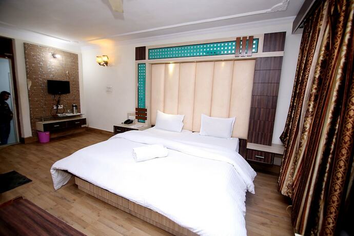Imagen de la habitación del Hotel Midtown, Haridwar. Foto 20