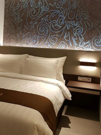 Imagen de la habitación del Hotel Midtown Samarinda. Foto 17