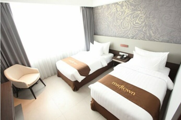 Imagen de la habitación del Hotel Midtown Samarinda. Foto 19