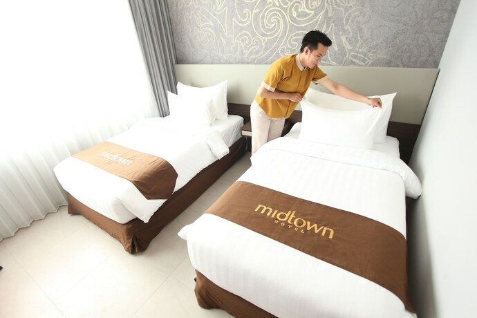 Imagen de la habitación del Hotel Midtown Samarinda. Foto 31