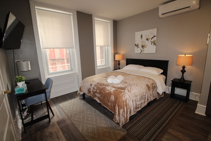 Imagen de la habitación del Hotel Midtown Suites. Foto 11