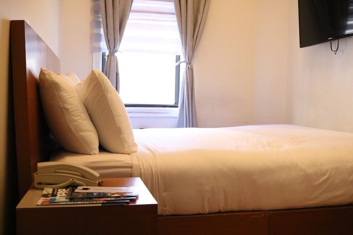 Imagen de la habitación del Hotel Midtown West. Foto 15