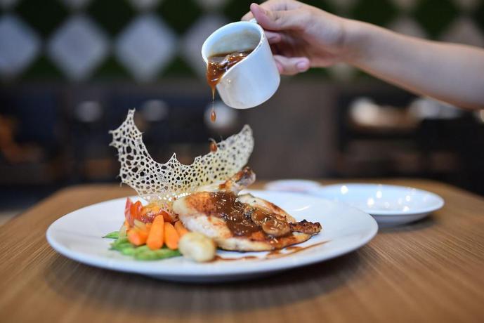 Imagen del bar/restaurante del Hotel Midtown Xpress Balikpapan. Foto 7