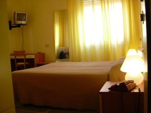 Imagen de la habitación del Hotel Mignon Posta. Foto 14
