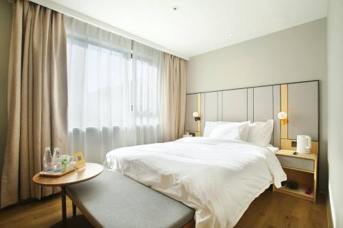 Imagen de la habitación del Hotel Miju House Jing'an. Foto 8