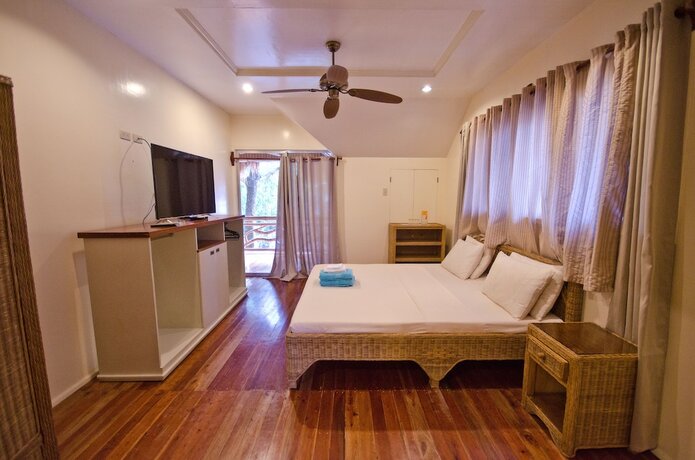 Imagen de la habitación del Hotel Mike's Dauin Beach Resort. Foto 17