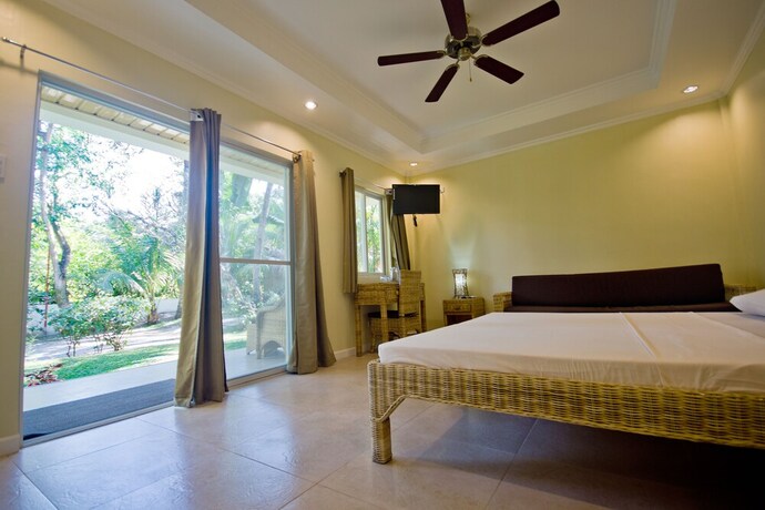 Imagen de la habitación del Hotel Mike's Dauin Beach Resort. Foto 21