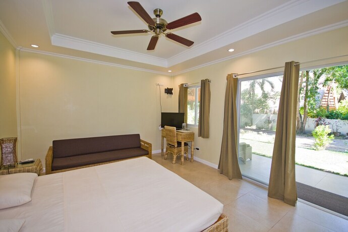 Imagen de la habitación del Hotel Mike's Dauin Beach Resort. Foto 22