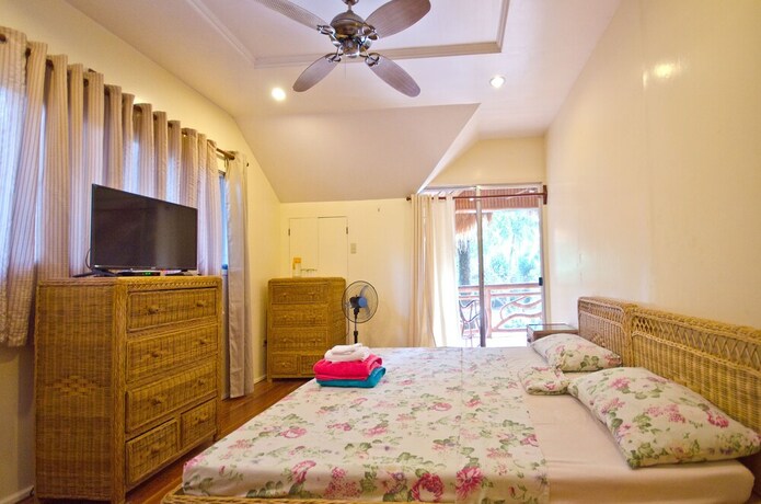 Imagen de la habitación del Hotel Mike's Dauin Beach Resort. Foto 23