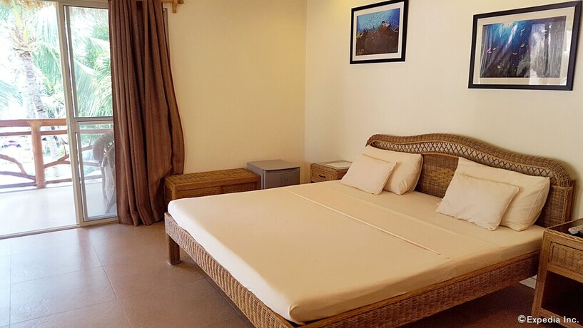 Imagen de la habitación del Hotel Mike's Dauin Beach Resort. Foto 34