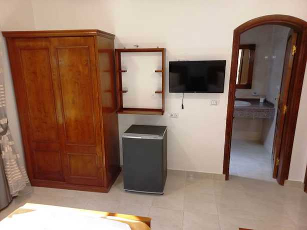 Imagen de la habitación del Hotel Mikhaila Guest House. Foto 13