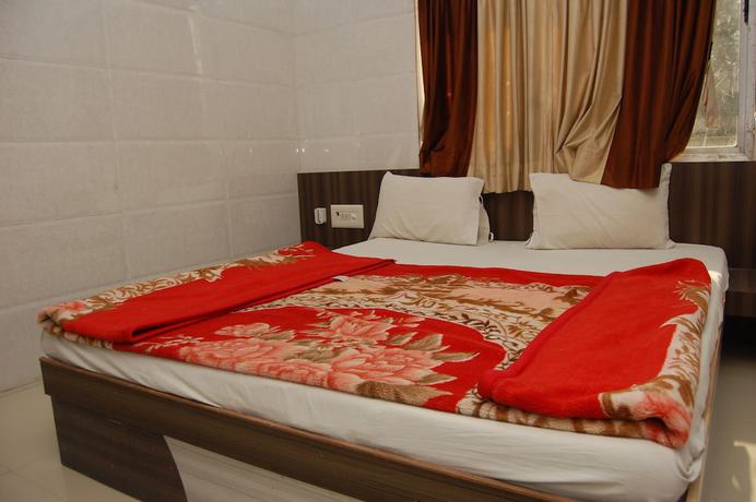 Imagen de la habitación del Hotel Milan, Dwarka. Foto 11