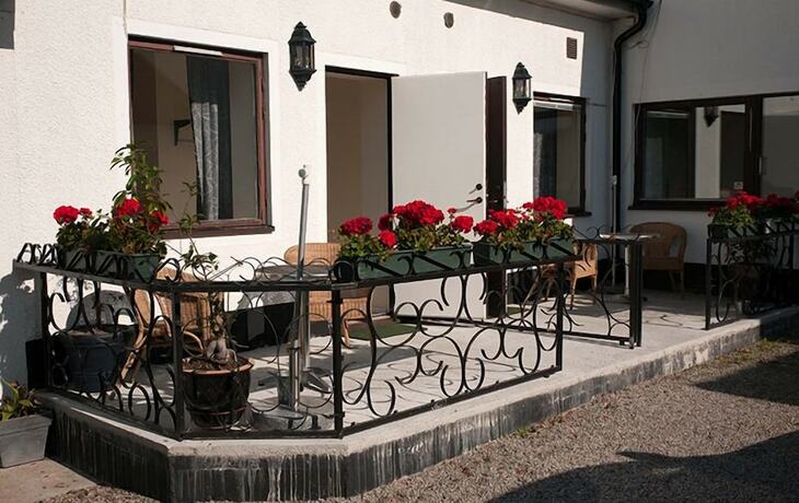 Imagen general del Hotel Milano Garden - City Bungalow l, I Gr&auml;nssnittet Till Kullabygdens P&auml;rlor. Foto 14