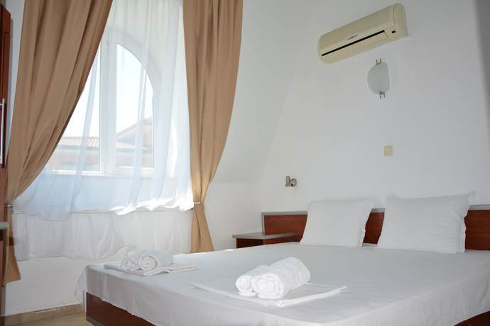 Imagen de la habitación del Hotel Milennia Family. Foto 9