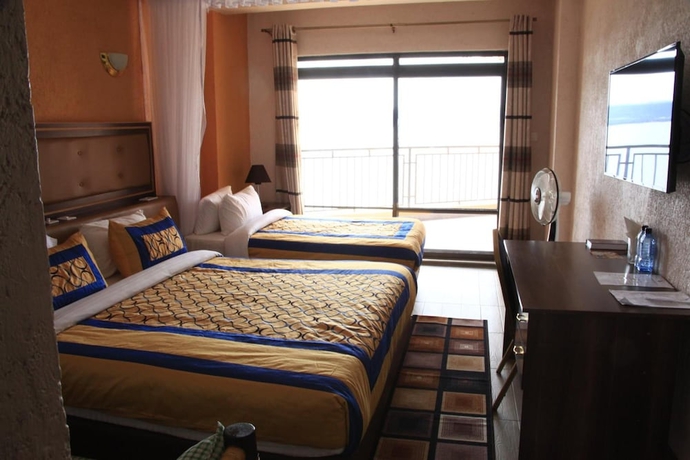 Imagen de la habitación del Hotel Milimani Beach Resort. Foto 16