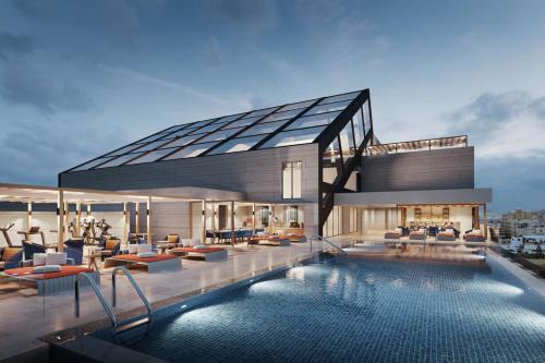 Imagen de la piscina del Hotel Millennium Al Masar. Foto 20