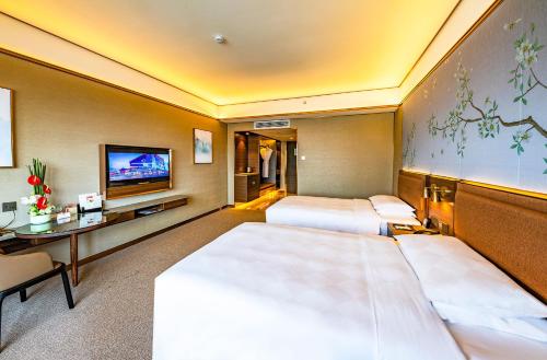 Imagen de la habitación del Hotel Millennium Harbourview Xiamen. Foto 4