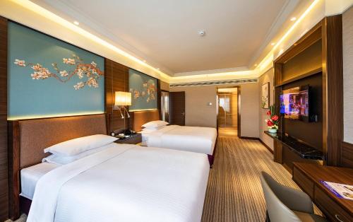 Imagen de la habitación del Hotel Millennium Harbourview Xiamen. Foto 7