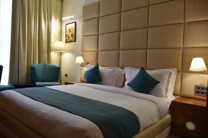 Imagen de la habitación del Hotel Millennium Inn, Allahabad. Foto 8