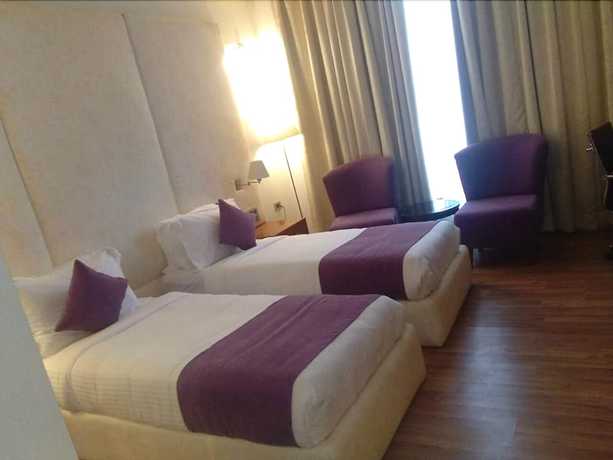 Imagen de la habitación del Hotel Millennium Inn, Allahabad. Foto 12