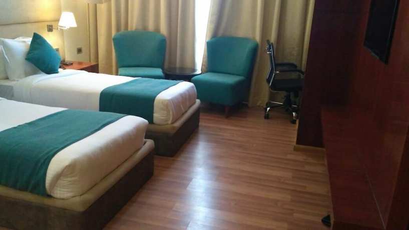 Imagen de la habitación del Hotel Millennium Inn, Allahabad. Foto 14