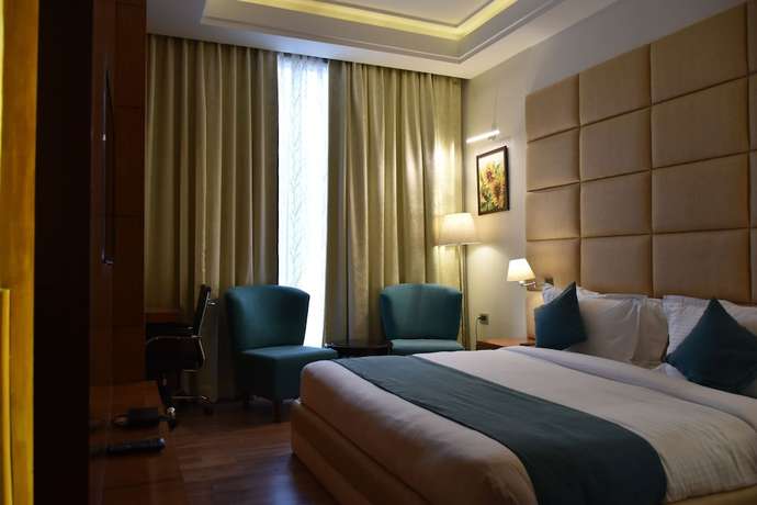 Imagen de la habitación del Hotel Millennium Inn, Allahabad. Foto 17