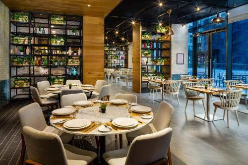 Imagen del bar/restaurante del Hotel Millennium Place Mirdif. Foto 2