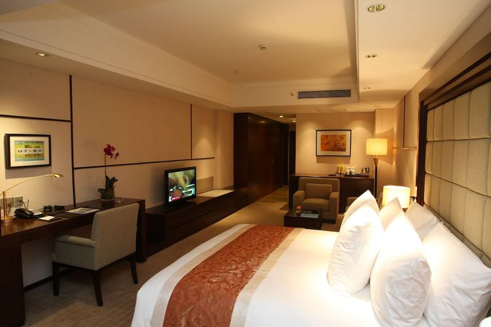 Imagen de la habitación del Hotel Millennium Wuxi. Foto 8