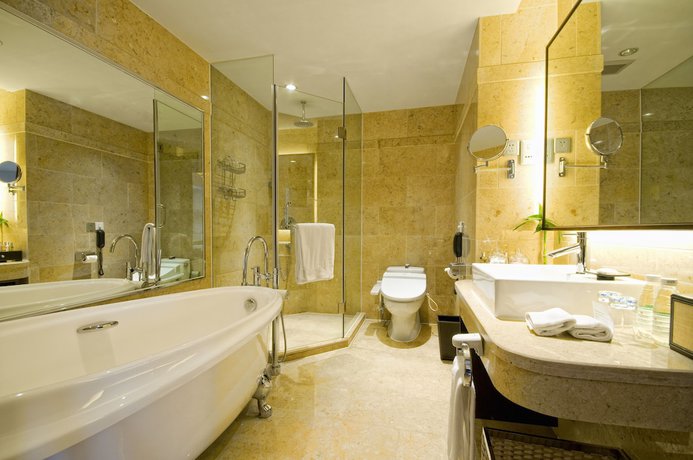 Imagen de la habitación del Hotel Millennium Wuxi. Foto 18