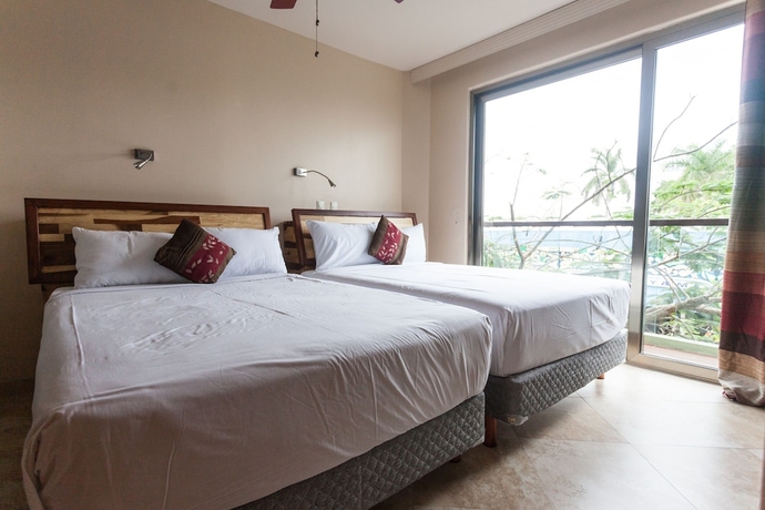 Imagen de la habitación del Hotel Mimosa Flat by Realty Group. Foto 10