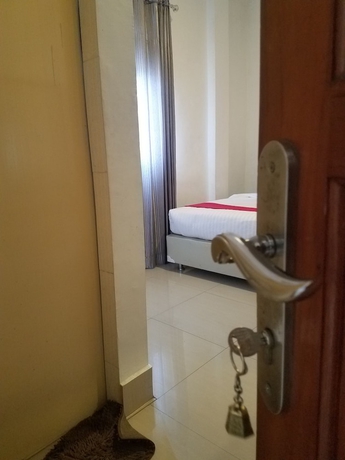 Imagen de la habitación del Hotel Mina Homestay Syariah. Foto 7