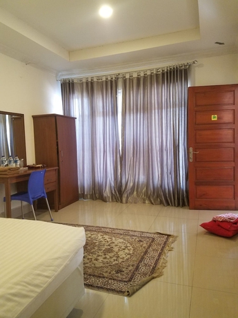 Imagen de la habitación del Hotel Mina Homestay Syariah. Foto 10