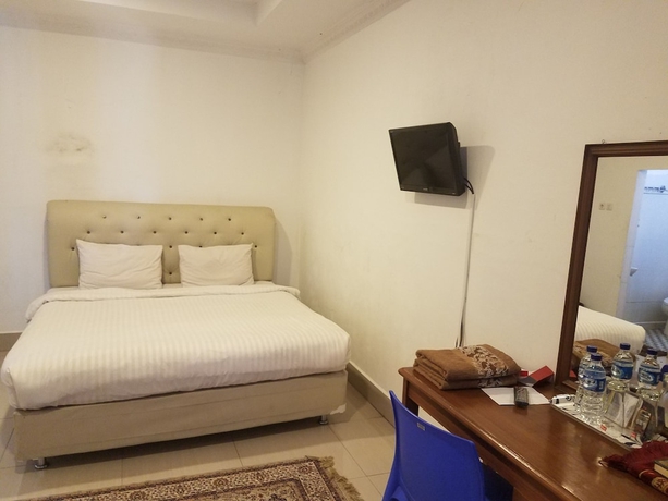 Imagen de la habitación del Hotel Mina Homestay Syariah. Foto 11
