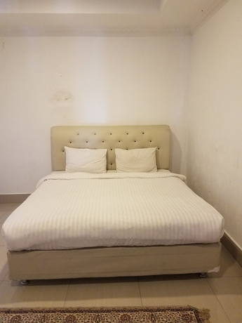 Imagen de la habitación del Hotel Mina Homestay Syariah. Foto 12