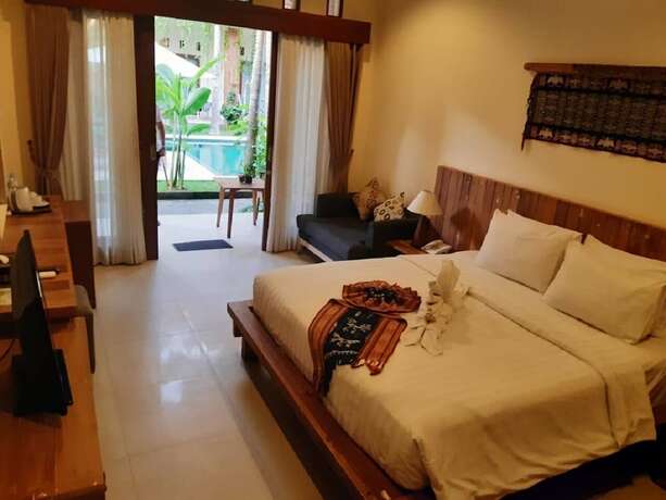 Imagen de la habitación del Hotel Mina Pelasa and Resto. Foto 12